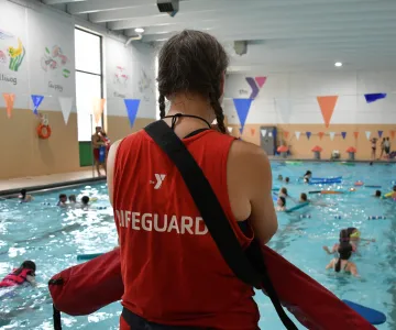 lifeguard watching pool